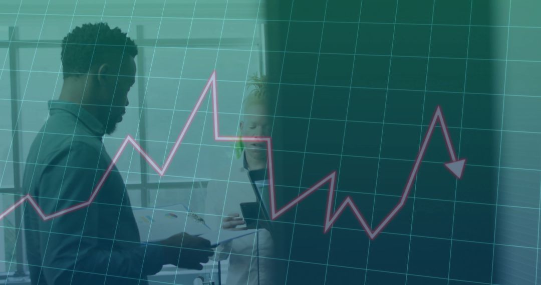 Colleagues Analyzing Financial Data with Graph Overlay in Modern Office