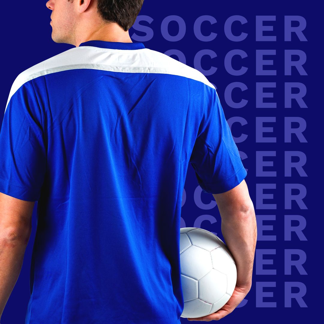 Soccer Player Holding Ball in Blue Jersey