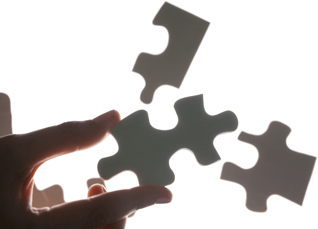 Hand Holding Puzzle Piece on Transparent Background