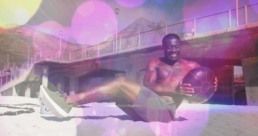 Fit Man Exercising with Medicine Ball on Beach with Light Effects