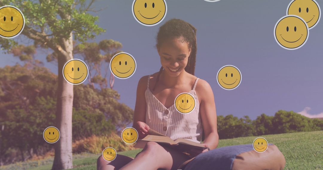Smiling Woman Reading in Park with Emoji Overlay