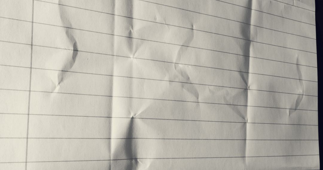 Crumpled Lined Paper Close Up with Shadows and Folds