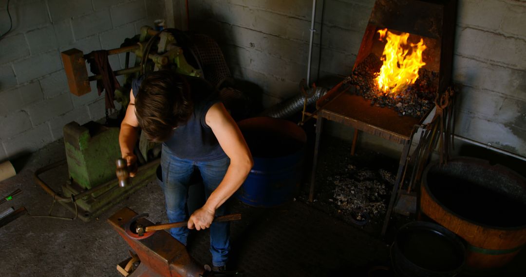 Skilled Blacksmith Shaping Metal in Workshop - Free Images, Stock Photos and Pictures on Pikwizard.com