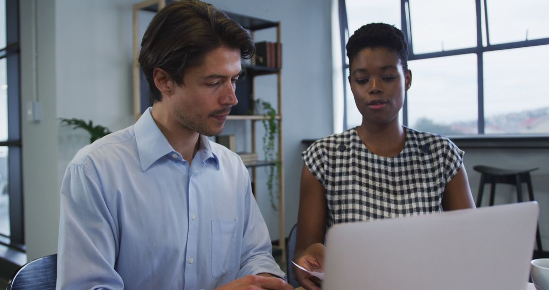Diverse Business Colleagues Collaborating in Office Setting