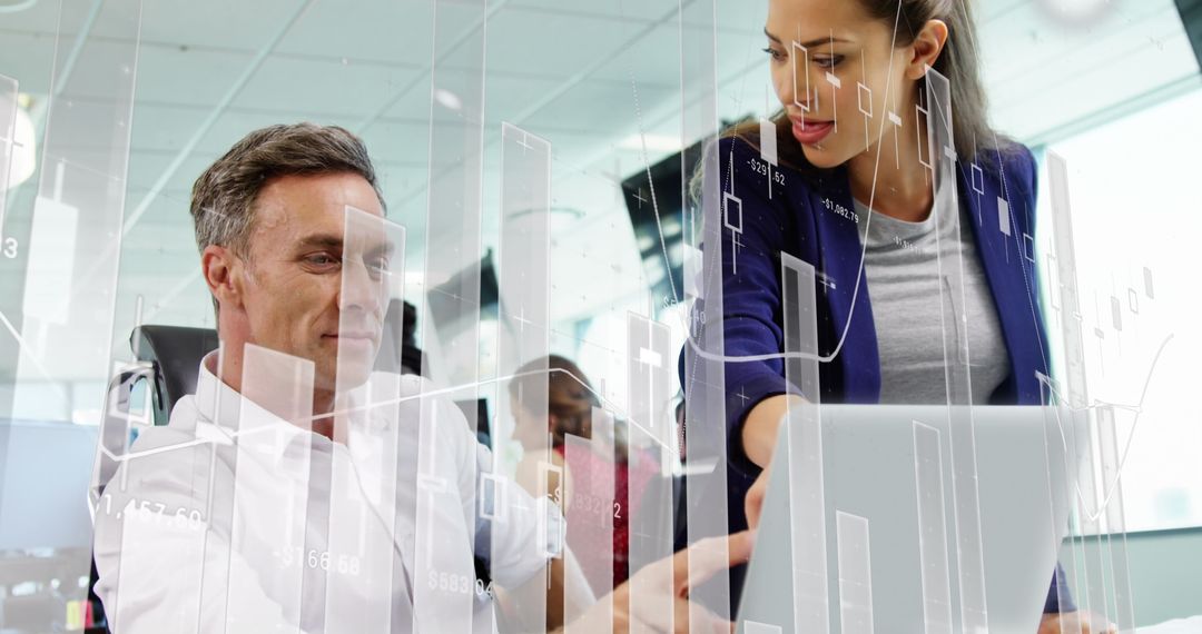 Business Professionals Analyzing Data with Interactive Technology Display