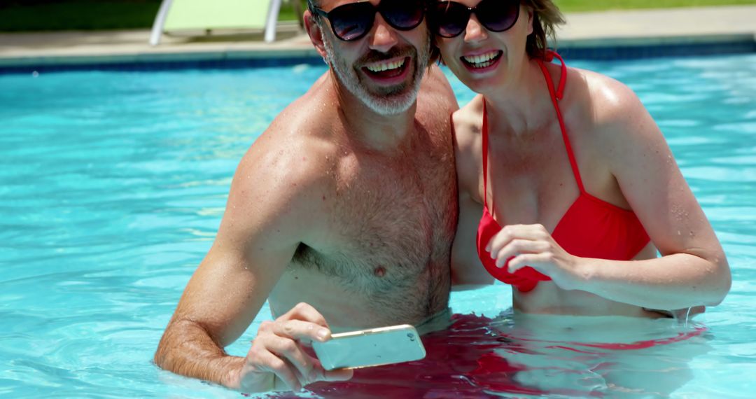 Happy Couple Taking Selfie in Swimming Pool - Free Images, Stock Photos and Pictures on Pikwizard.com