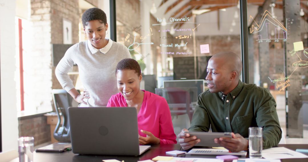 Team Collaboration in Modern Office with Digital Devices