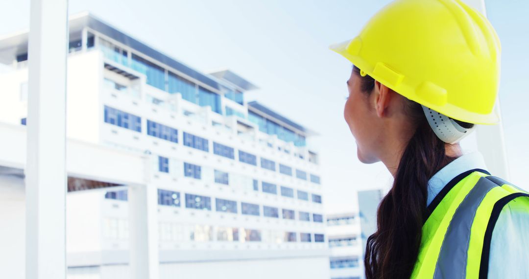 Female Architect Inspecting Building Site Wearing Safety Gear - Free Images, Stock Photos and Pictures on Pikwizard.com