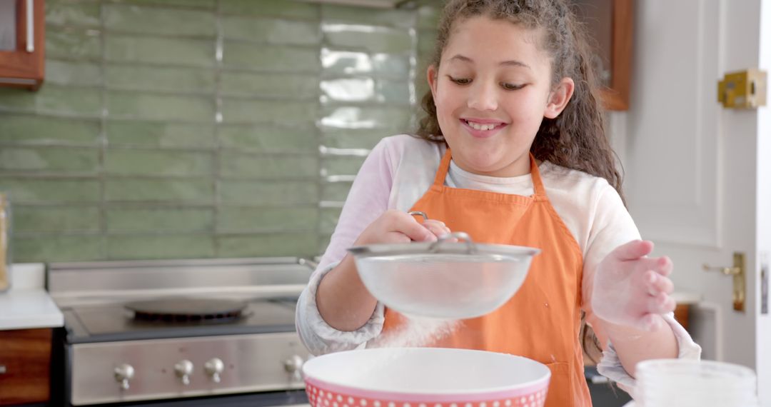 Young Girl Enjoying Baking in Home Kitchen - Free Images, Stock Photos and Pictures on Pikwizard.com