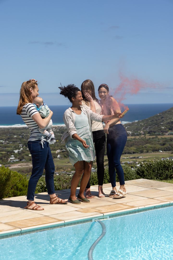 Group of Diverse Women with Baby and Smoke Flare by Poolside