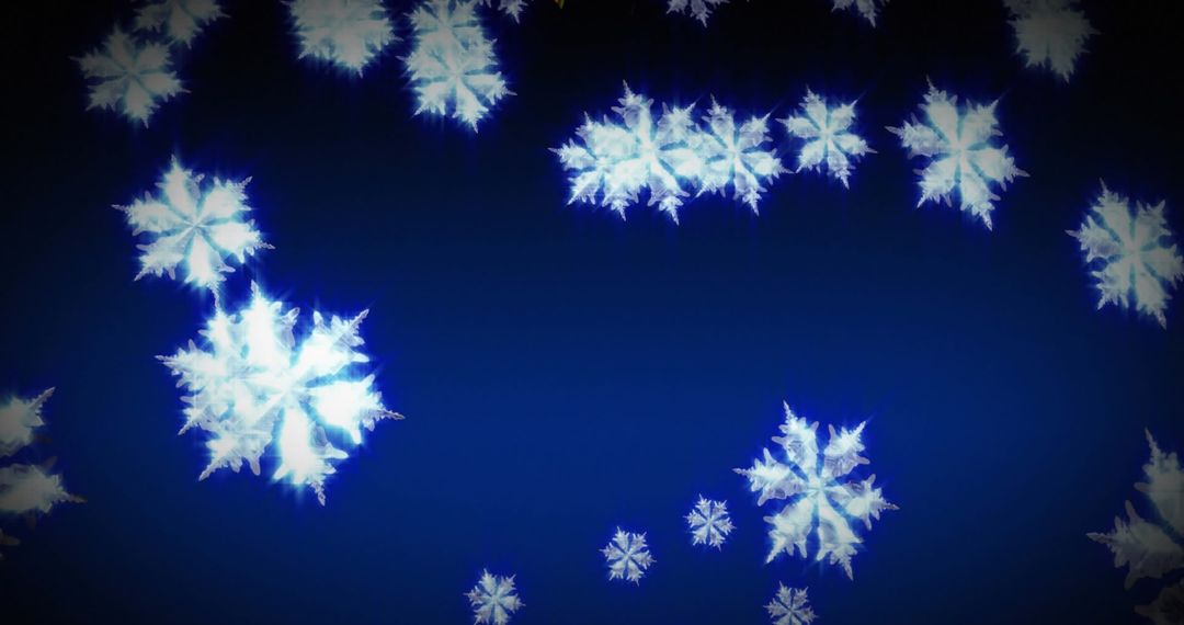 Radiant Snowflakes Falling on Deep Blue Background