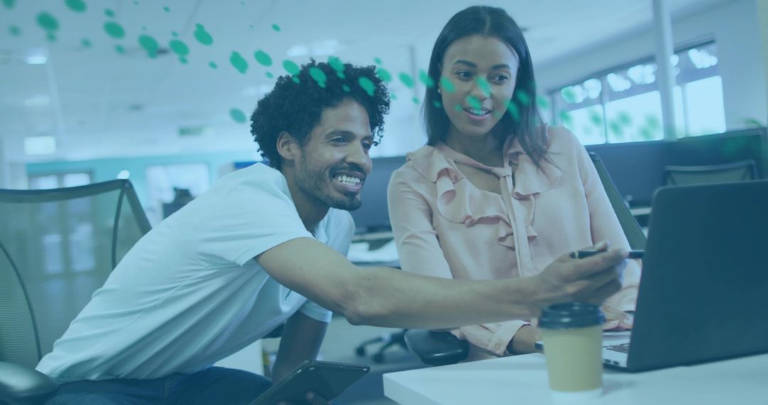 Coworkers Collaborating on Project in Modern Office Space