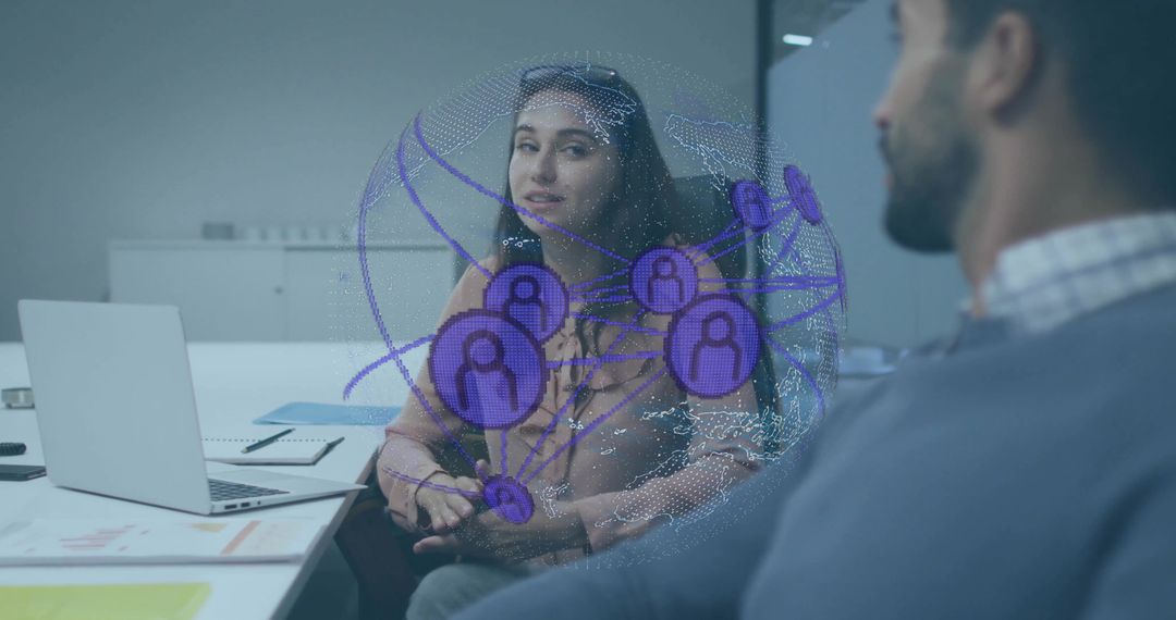 Coworkers Discuss Digital Network Hologram in Office Environment