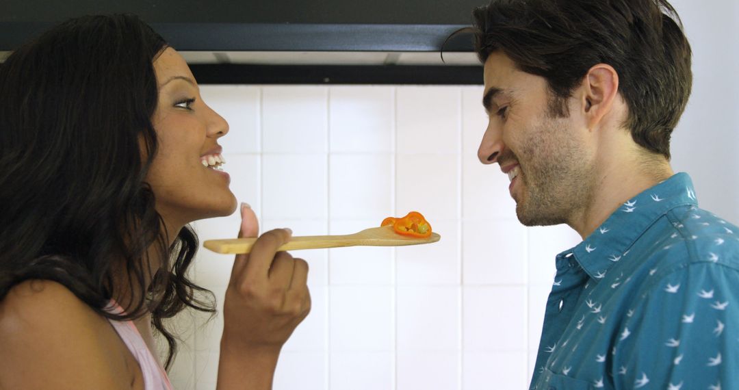 Couple Enjoying Cooking Together in Kitchen - Free Images, Stock Photos and Pictures on Pikwizard.com