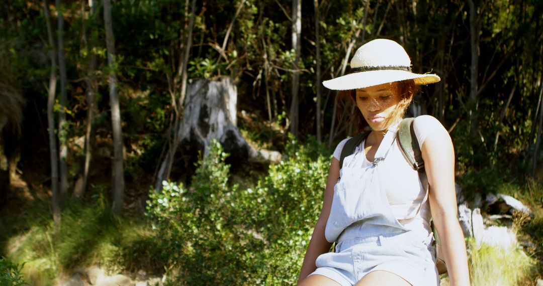 Young African American Woman Hiking Wearing Sun Hat - Free Images, Stock Photos and Pictures on Pikwizard.com