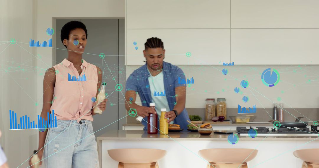 Couple preparing burgers in modern smart kitchen with holographic data analytics overlays