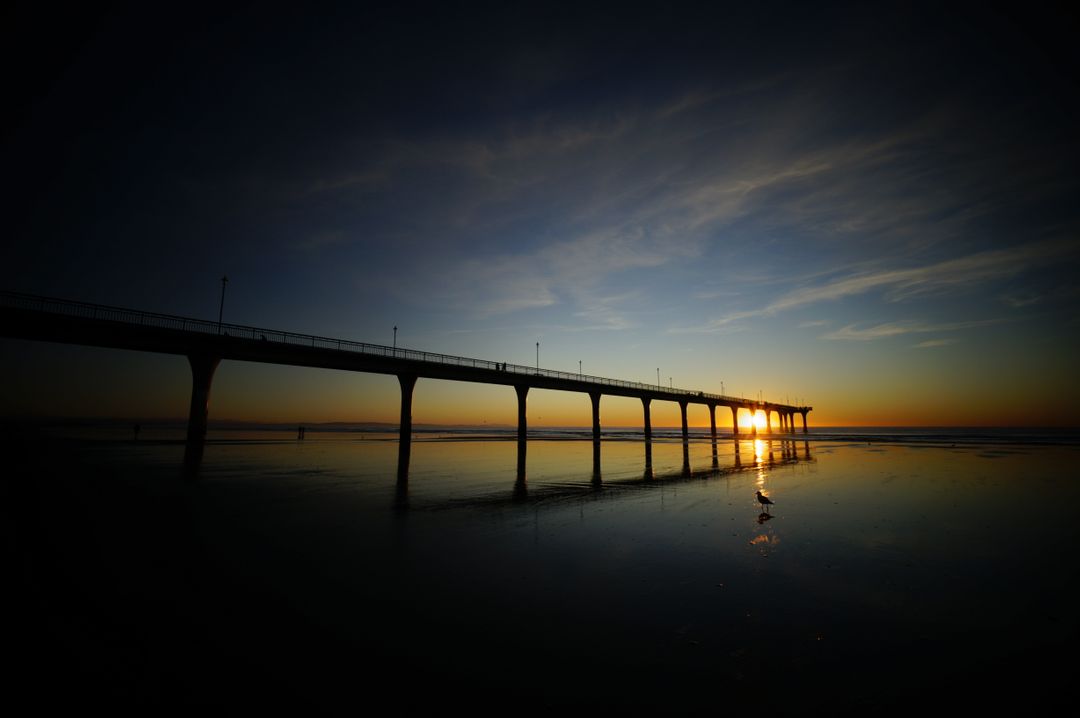 Sunset Glow Under Pier Silhouette - Free Images, Stock Photos and Pictures on Pikwizard.com