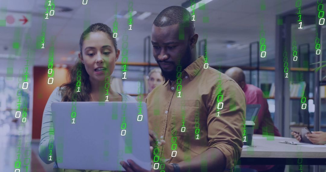 Team of Diverse Developers Analyzing Laptop with Futuristic Code Overlay