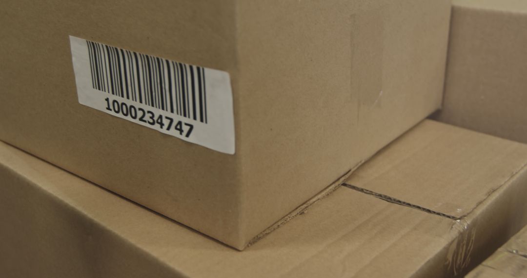 Scanning a barcode on a box in a warehouse - Free Images, Stock Photos and Pictures on Pikwizard.com