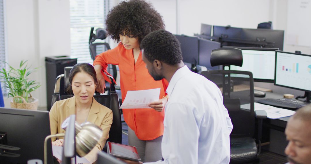 Diverse Team Collaborating on Project in Office