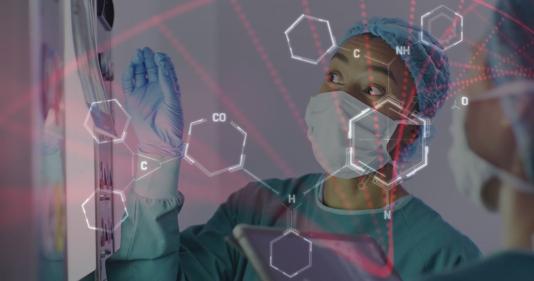 Asian Surgeon Analyzing Digital Medical Data During Operation