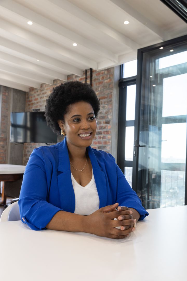 Confident Executive in Modern Office Setting