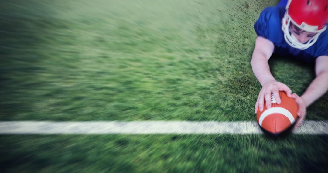 American Football Player Making Touchdown on Grass Field