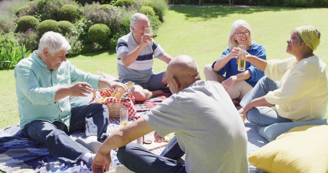 Seniors Enjoying Outdoor Picnic in Sunlit Garden - Free Images, Stock Photos and Pictures on Pikwizard.com