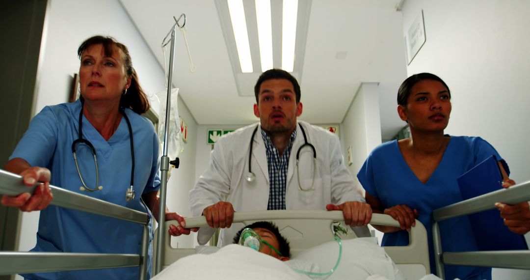 Medical Team Rushing Patient Through Hospital Corridor - Free Images, Stock Photos and Pictures on Pikwizard.com