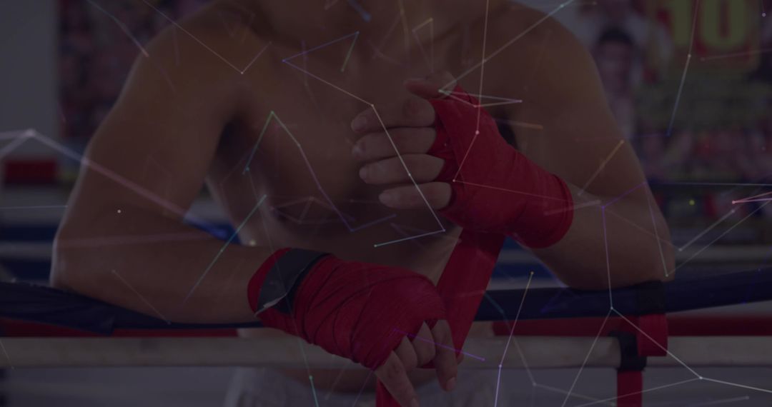 Boxer Wrapping Hands in Gym Featuring Determination and Focus