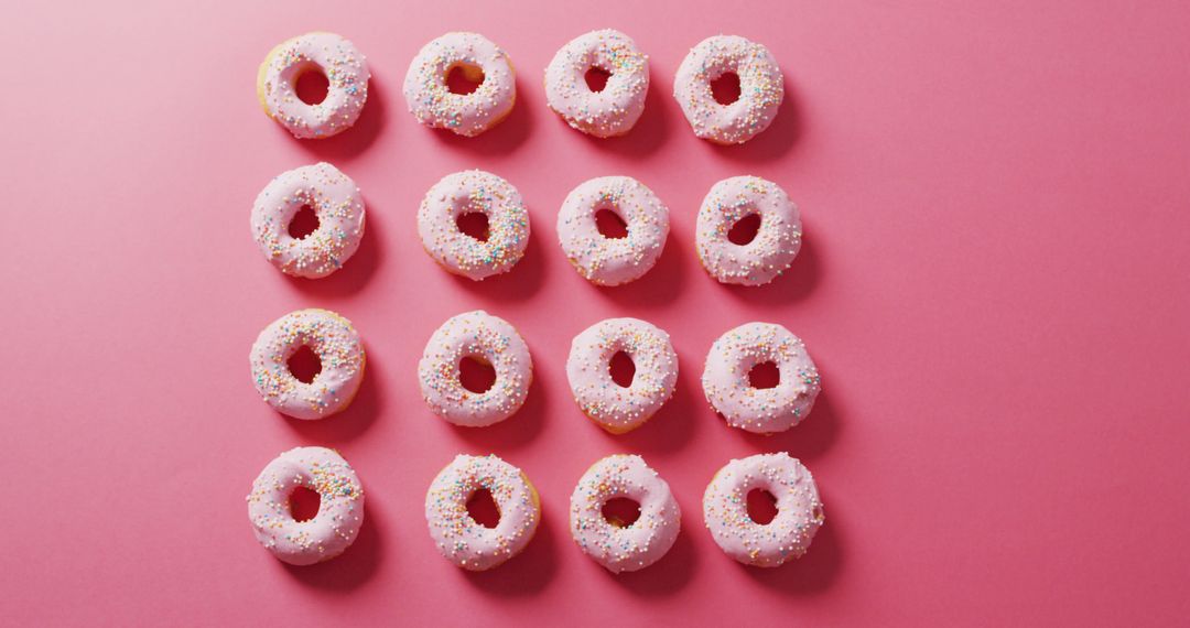 Pink Frosted Donuts with Sprinkles on Pink Background, Flat Lay Arrangement - Free Images, Stock Photos and Pictures on Pikwizard.com