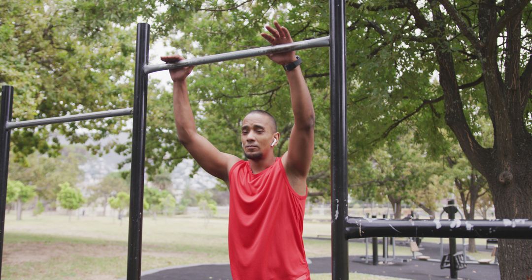 Man Exercising on Pull-up Bar in Outdoor Park - Free Images, Stock Photos and Pictures on Pikwizard.com