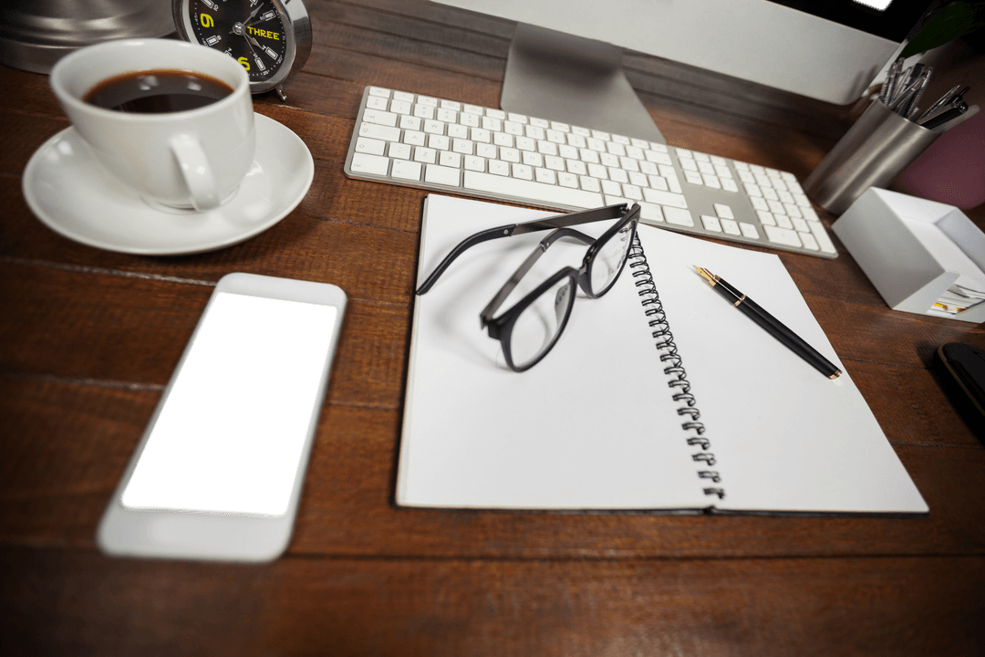 Transparent Desktop Arrangement with Phone Glasses Coffee Notebook
