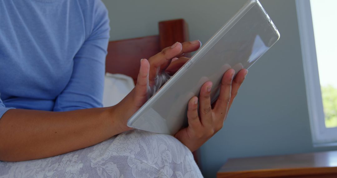 Person Sitting in Bed Using Digital Tablet - Free Images, Stock Photos and Pictures on Pikwizard.com