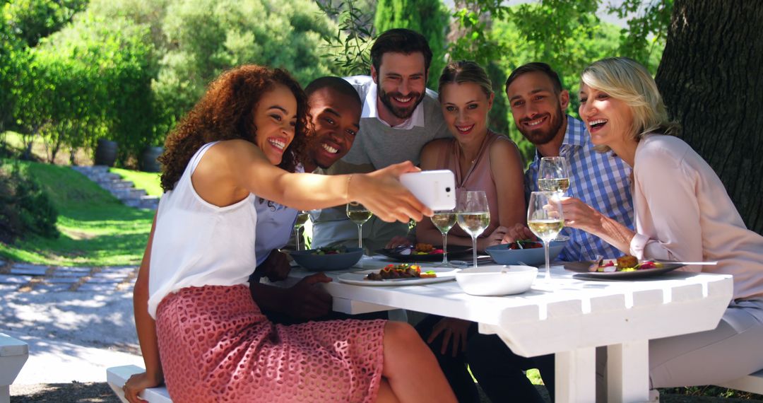 Friends Taking Selfie at Outdoor Restaurant Gathering - Free Images, Stock Photos and Pictures on Pikwizard.com