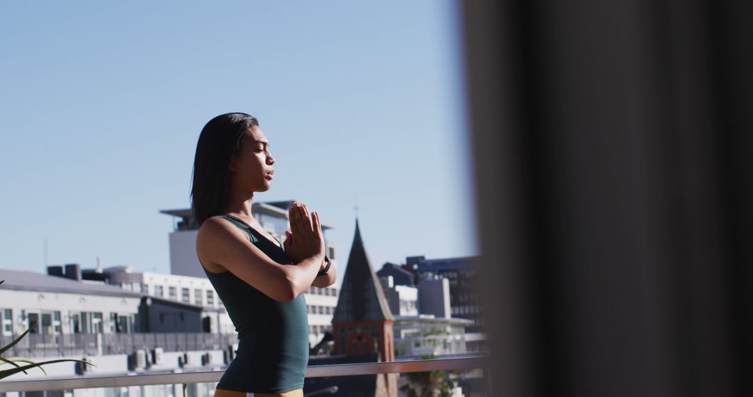 Meditative Woman Practicing Yoga on City Balcony - Free Images, Stock Photos and Pictures on Pikwizard.com