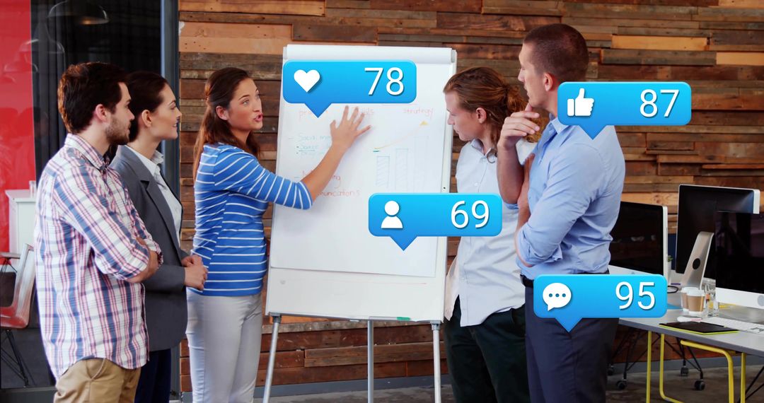 Team Brainstorming with Social Media Engagement Icons in Office