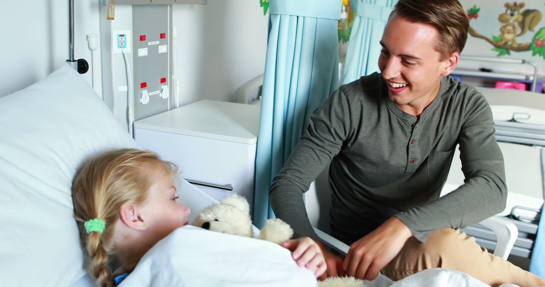 Caring Father Comforting Daughter in Hospital with Teddy Bear - Free Images, Stock Photos and Pictures on Pikwizard.com