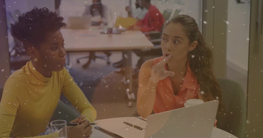 Two Colleagues Having Collaborative Meeting at Office Desk