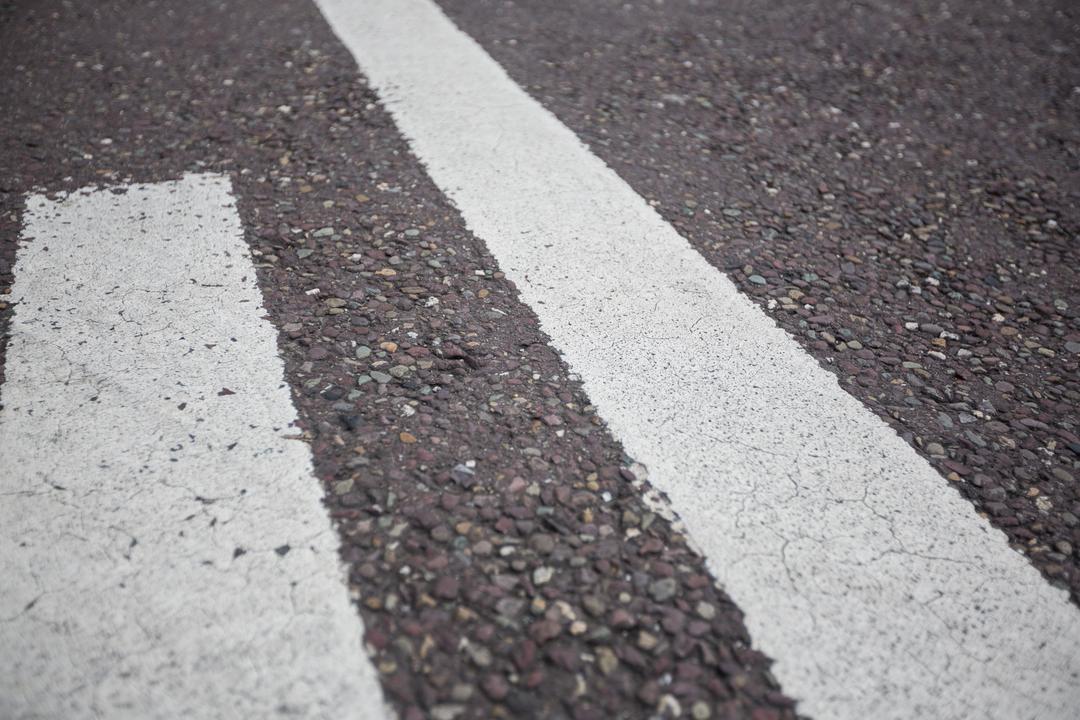 Close-Up of Road Markings on Asphalt Surface - Free Images, Stock Photos and Pictures on Pikwizard.com