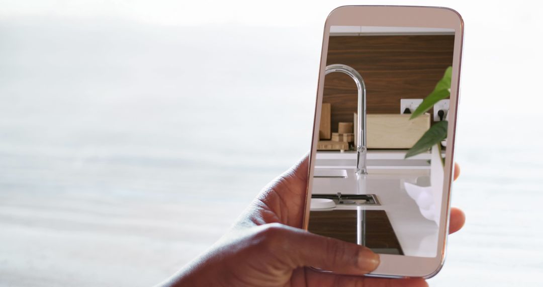 Smart Device Displaying Modern Kitchen Faucet Innovation