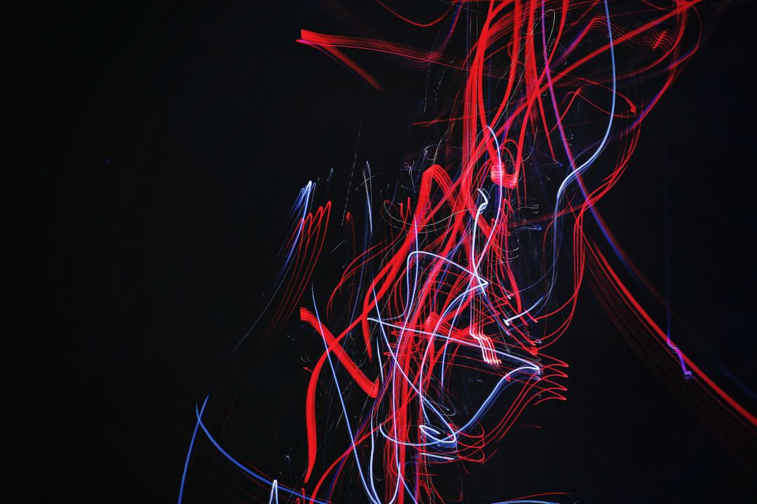 Abstract Light Trails in Dark Background with Red and Blue Streaks - Free Images, Stock Photos and Pictures on Pikwizard.com