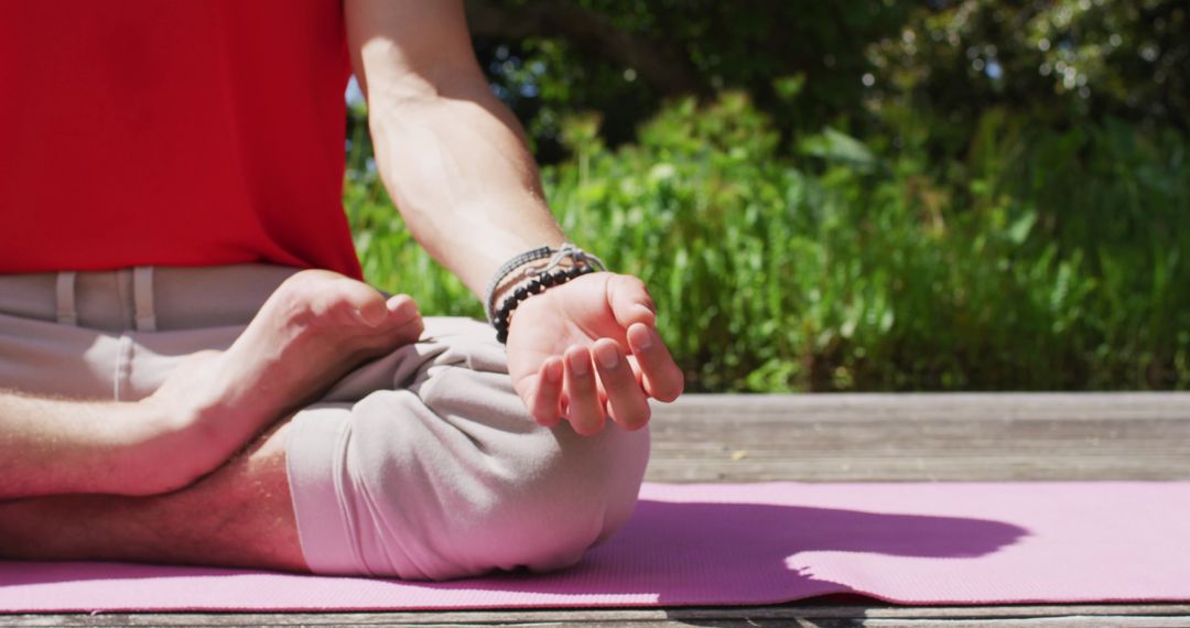 Man Practicing Yoga in Garden Setting, Relaxing Outdoors