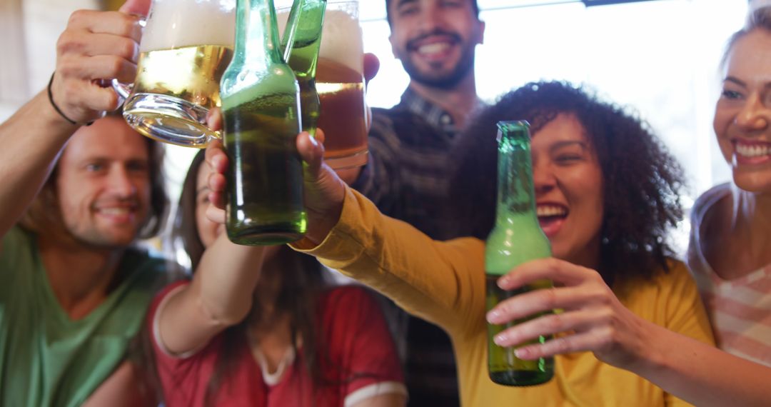 Diverse Group of Friends Celebrating with Beers in Stylish Bar