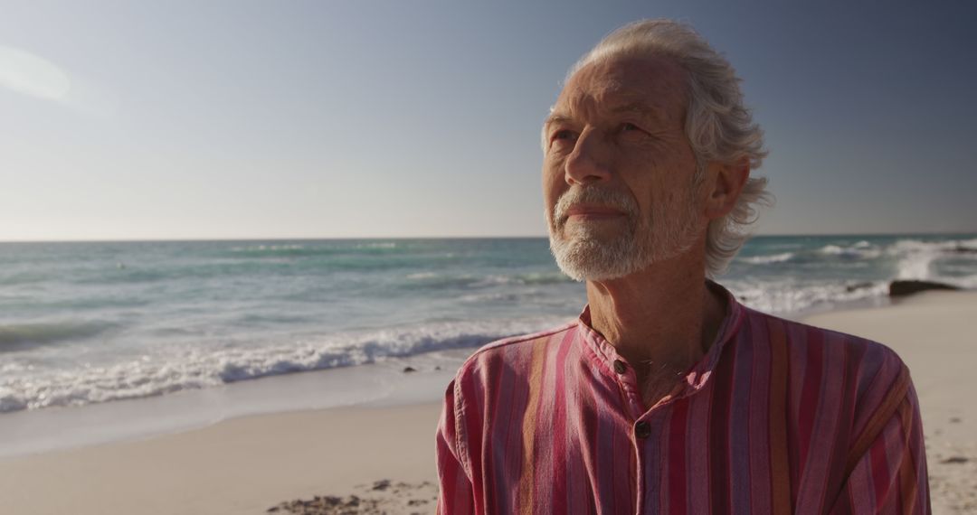 Senior Man Enjoying Peaceful Beach Sunset - Free Images, Stock Photos and Pictures on Pikwizard.com