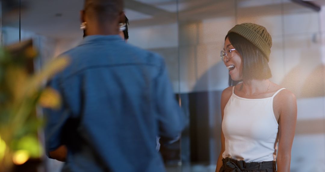 Asian Woman Smiling with Colleagues in Modern Office