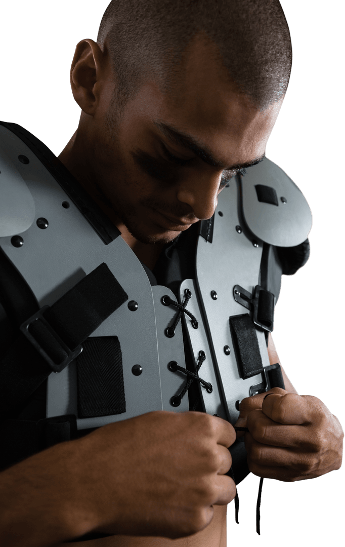 Focused Football Player Adjusting Protective Gear in Transparent Background
