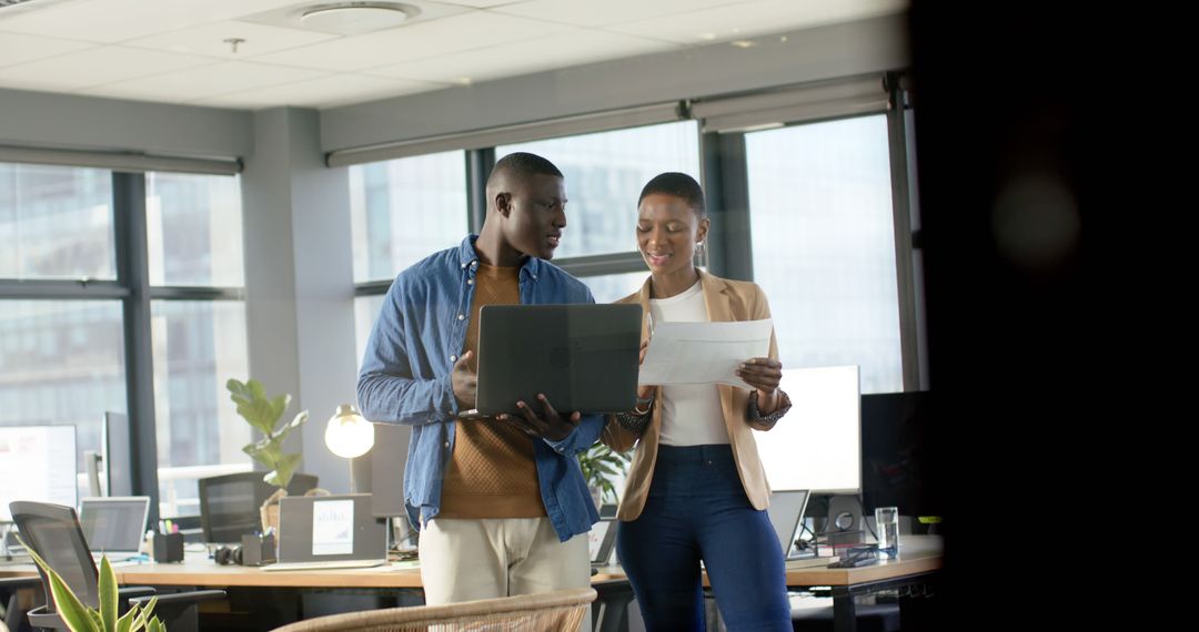 Professionals Collaborating in Modern Office Environment