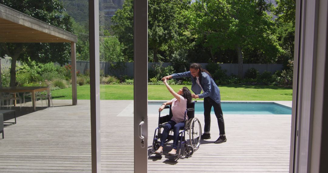 Caregiver Helping Woman in Wheelchair on Patio Near Pool - Free Images, Stock Photos and Pictures on Pikwizard.com