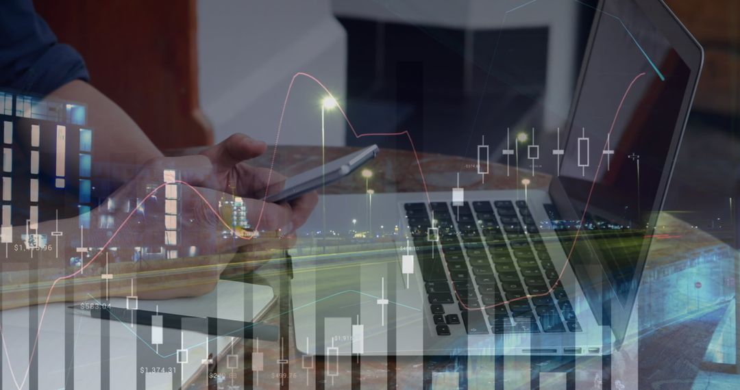 Businessman Analyzing Financial Charts with Smartphone and Laptop